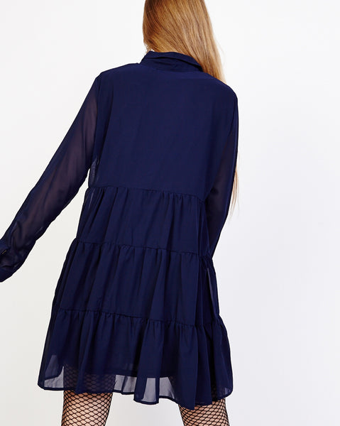 Bella London Paola Navy Chiffon Shirt Dress With Sheer Sleeves And Ruffled Skirt. Back View.