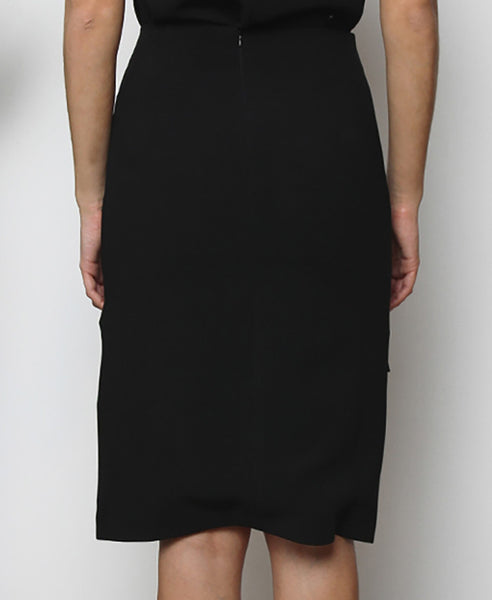 Bella London Black dipped hem pencil skirt with side slits and fold-over front waistband. Back close up photo.