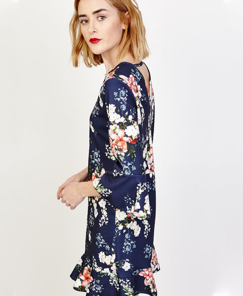 Bella London Willa Navy Floral Bell Sleeve Shift Dress With Ruffle Hem. Side View
