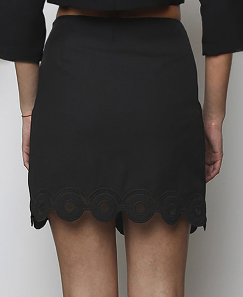 Bella London Black mini skirt with embroidered scalloped hem and organza inserts. Back photo.