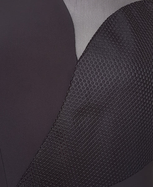Bella London Panelled asymmetric black dress with mesh inserts. Fabric photo